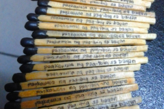 Detail image of my personal penmanship written on the sides of every matchsticks.